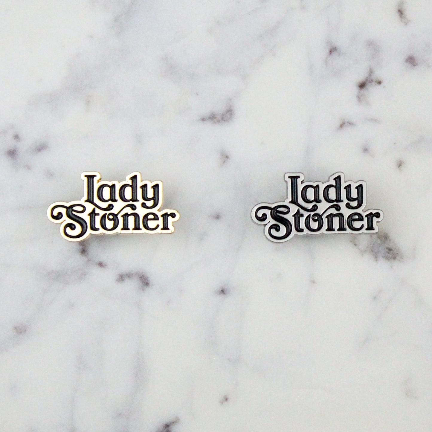 gold and silver lady stoner enamel pins side by side